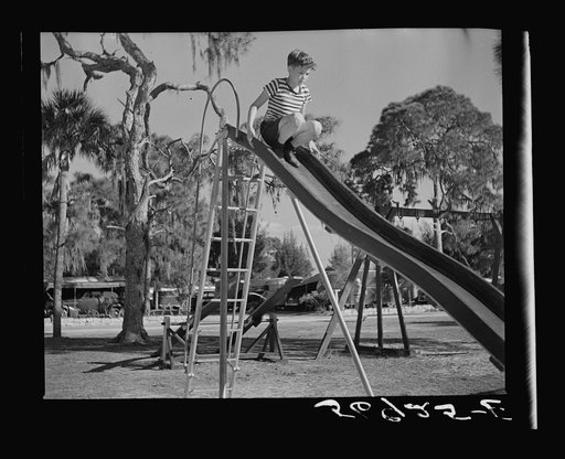 Playing in the playground in Sarasota trailer park. Sarasota, Florida