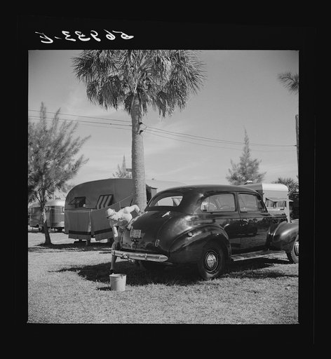 Untitled photo, possibly related to: Guest at Sarasota trailer park, Sarasota, Florida, washing his car