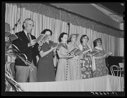 Choir singing at Sunday church service held in Sarasota trailer park. Sarasota, Florida