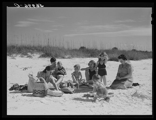 Untitled photo, possibly related to: Guests of Sarasota trailer park, Sarasota, Florida, picnicking at the beach with their family and neighbor's children