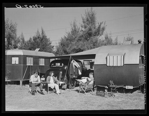 Guests at the Sarasota trailer park sitting outside their trailer homes. Sarasota, Florida