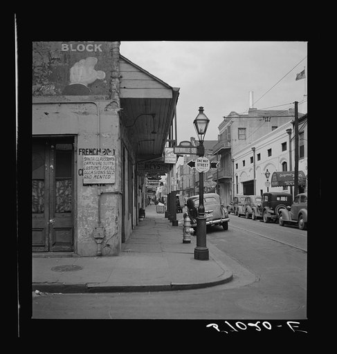 Sign on shop advertising costumes for Mardi Gras. New Orleans, Louisiana