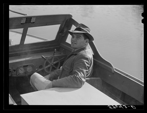 Weldon P. Smith, FSA (Farm Security Administration) supervisor, going out in the bayous and marshes to visit some of the muskrat trappers and marshes. Near Delacroix, Island, Louisiana. See general caption number one