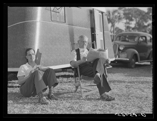 Untitled photo, possibly related to: Reading the newspaper outside his trailer home. Sarasota trailer park, Sarasota, Florida
