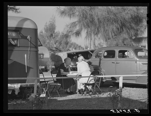 Guests of trailer park playing Chinese checkers outside their trailer home. Sarasota trailer park, Sarasota, Flordia