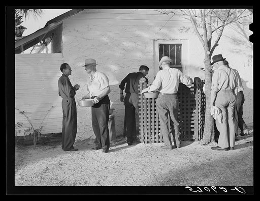 Migratory workers waiting to receive surplus commodities. Belle Glade, Florida