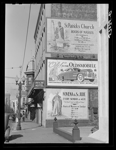 Untitled photo, possibly related to: Billboards on side of building. New Orleans, Louisiana