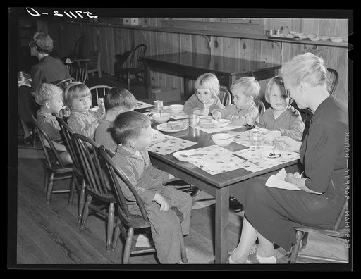 Children of migratory workers eating lunch in twenty-four hour nursery at Osceola migratory labor camp built by FSA (Farm Security Administration). Belle Glade, Florida