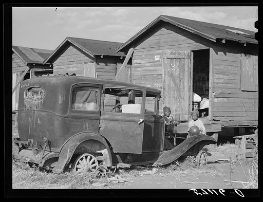 Houses condemned by board of health still lived in by migratory laborers.  Belle Glade, Florida