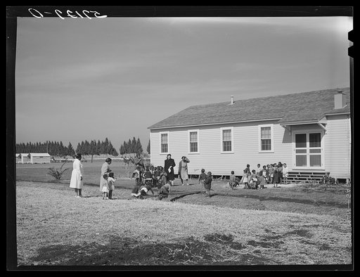 Untitled photo, possibly related to: Children of migratory laborers outside of day nursery at Okeechobee migratory labor camp. Belle Glade, Florida