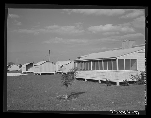 Rear view of clinic and metal shelters at Osceola migratory labor camp.  Belle Glade, Florida