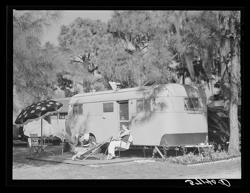 Relaxing outside their trailer home, Sarasota trailer park, Sarasota, Florida