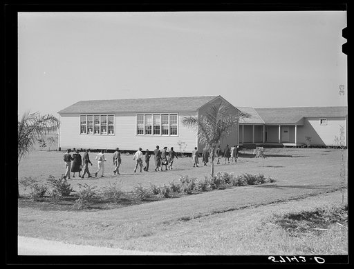 Agricultural workers' children going into new school at Okeechobee migratory labor camp. Belle Glade, Florida