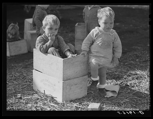 Agricultural and packing house workers' children playing outside of twenty-four hour a day nursery at Osceola migratory labor camp. Belle Glade, Florida