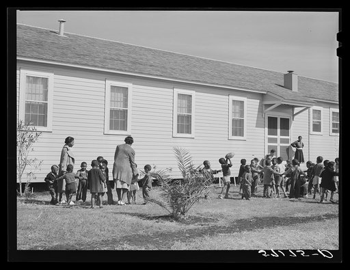 Children of migratory laborers outside of day nursery at Okeechobee migratory labor camp. Belle Glade, Florida