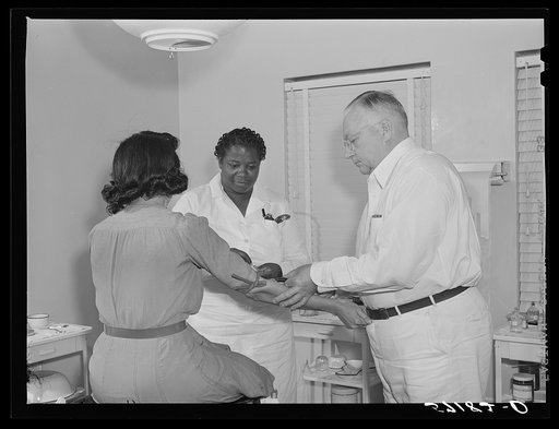 Taking a Wasserman blood test in clinic for agriculture workers. Okeechobee migratory labor camp, Belle Glade, Florida