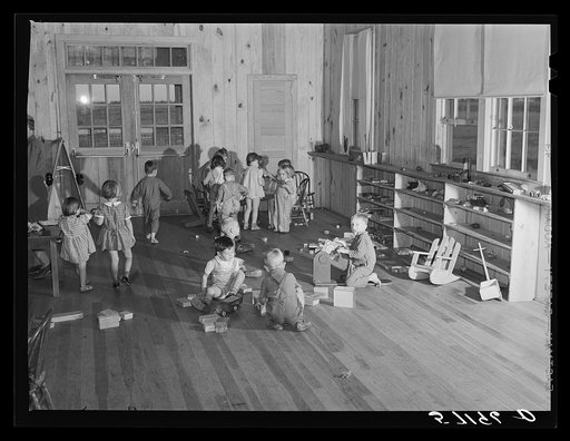 Agricultural and packing house workers' children playing in the twenty-four hour a day nursery at Osceola migratory labor camp. Belle Glade, Florida