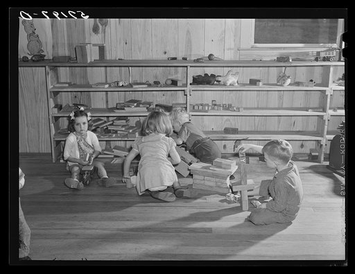 Agricultural and packing house workers' children playing in the twenty-four hour a day nursery at Osceola migratory labor camp. Belle Glade, Florida