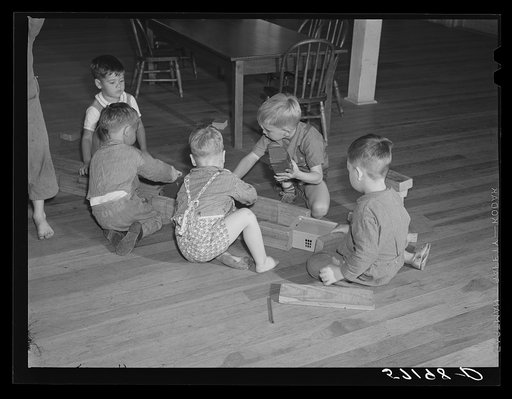 Agricultural and packing house workers' children playing in the twenty-four hour a day nursery at Osceola migratory labor camp. Belle Glade, Florida