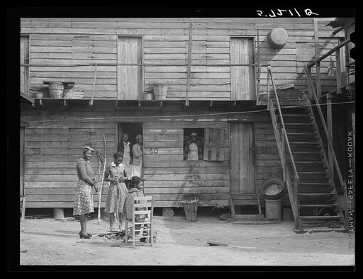 Untitled photo, possibly related to: "Hotel" in Pahokee, Lake Okeechobee, Florida, living quarters for migratory agricultural workers