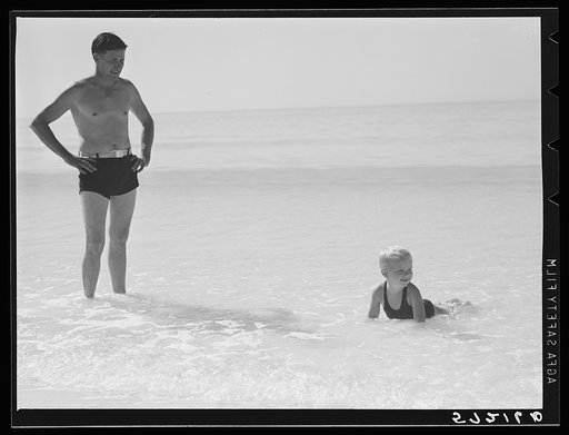 Untitled photo, possibly related to: Guest of Sarasota trailer park, Sarasota, Florida, with his family, picnicking at the beach