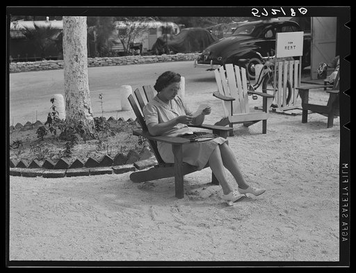 One of the occupants of Sarasota trailer park reading her mail. Sarasota, Florida