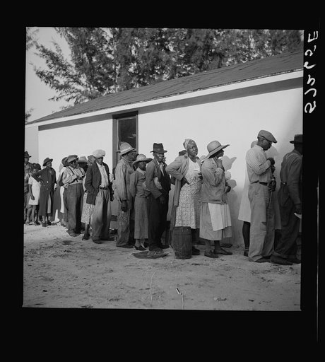 Migratory workers waiting to receive supplies of surplus commodities. Belle Glade, Florida