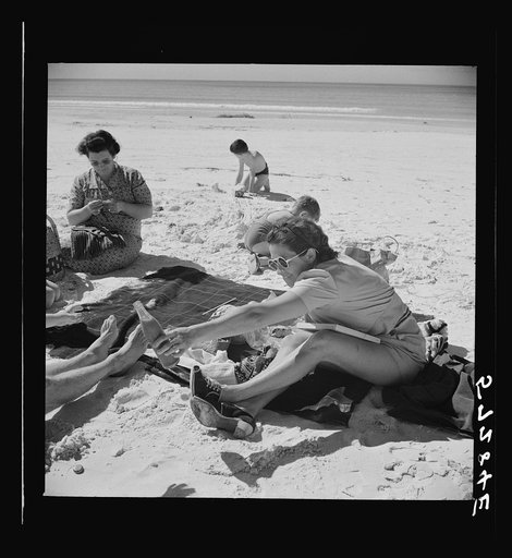 Untitled photo, possibly related to: Guest of Sarasota trailer park, Sarasota, Florida, at the beach with her family