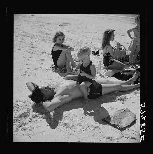 Guest of Sarasota trailer park, Sarasota, Florida, with his family, picnicking at the beach