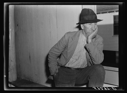 Spanish trapper watching fur auction sale in dance hall. Delacroix Island, Louisiana