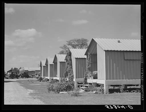 Metal shelters for agricultural works. Osceola migratory labor camp. Belle Glade, Florida