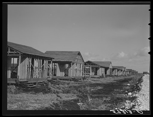 Buildings being erected for migratory labor in Pahokee, Florida