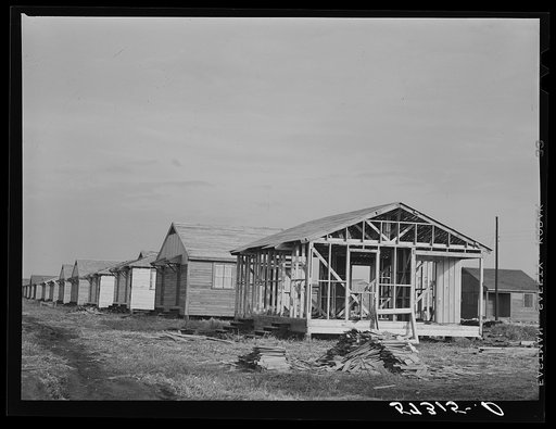 Buildings being erected for migratory labor in Pahokee, Florida