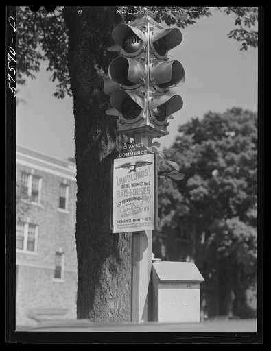 Sign on traffic stop-light in Hartford, Connecticut indicating housing shortage