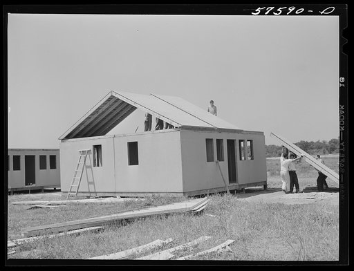 Untitled photo, possibly related to: Prefabricated defense housing under construction near airport. Hartford, Connecticut. Constructed and managed by FSA (Farm Security Administration)