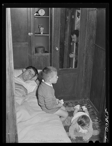 Frank Robbins of Wareham, Massachusetts, employed at United Aircraft, East Hartford, Connecticut, lives in trailer near the plant, with wife and four children because of housing shortage. He works nights, so he can sleep days in a bed used at night by two of the children. He makes forty dollars a we