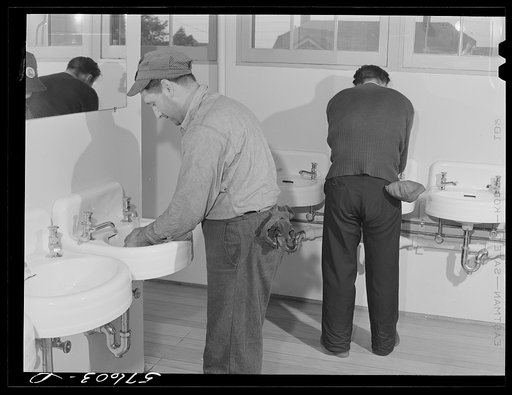 Untitled photo, possibly related to: Workers from electric boat company plant in washroom of new dormitories for defense workers. Groton, Connecticut. Constructed and managed by FSA (Farm Security Administration)
