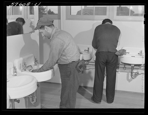 Workers from electric boat company plant in washroom of new dormitories for defense workers. Groton, Connecticut. Constructed and managed by FSA (Farm Security Administration)