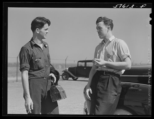 Rolfe Chickering, farmboy from Saint Johnsbury, Vermont, now working at Pratt and Whitney United Aircraft, East Hartford, Connecticut. He is talking to his friend with whom he commutes to Suffield, Connecticut (see 57612D)