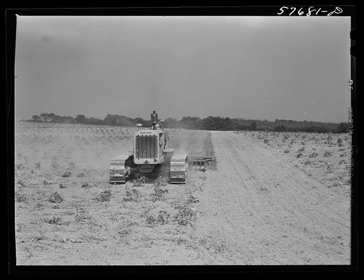 Harrowing fields with diesel tractors at Seabrook Farms. Bridgeton, New Jersey