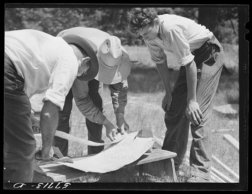 Galvanized sheet steel of 24 gauge is used as corner reinforcement. Screen door construction demonstration. Charles County, La Plata, Maryland