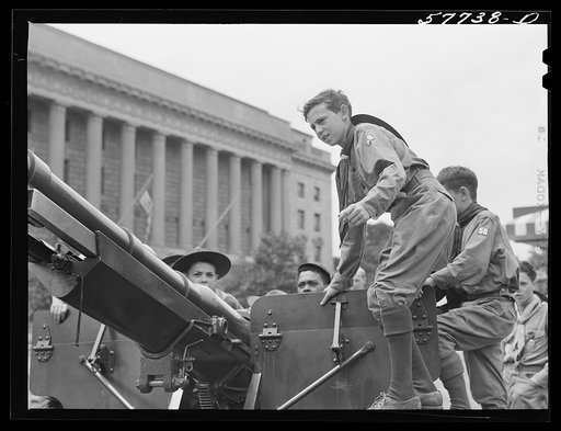 Boy scouts inspecting and learning about Army equipment in Commerce Square, Washington, D.C.