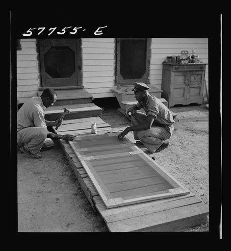 Metal reinforcing is placed over joints on inside face. Demonstration of home screen door construction. Saint Mary's County, Ridge, Maryland