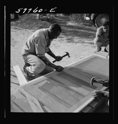 Untitled photo, possibly related to: Tacking the mesh galvanized screen wire to back of door frame. Screening demonstration. Saint Mary's County, Ridge, Maryland