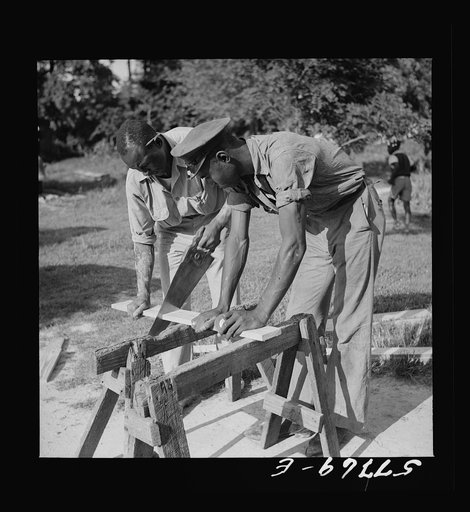 Untitled photo, possibly related to: Cutting screen door stock to measurement. Saint Mary's County, Ridge, Maryland. Screening demonstration