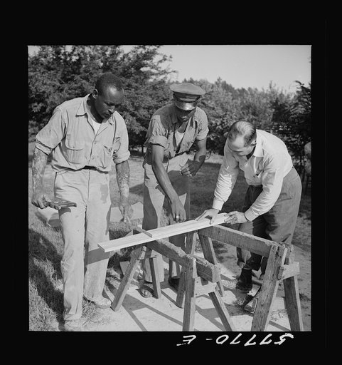 Cutting screen door stock to measurement. Screening demonstration. Saint Mary's County, Ridge, Maryland