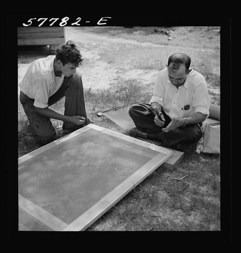 Untitled photo, possibly related to: Door frame with screen wire assembled ready to fasten on hinge strip. Screening demonstration. Charles County, La Plata, Maryland