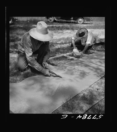 Cutting 16-mesh galvanized screen wire for door frame. Screening demonstration. Charles County, La Plata, Maryland