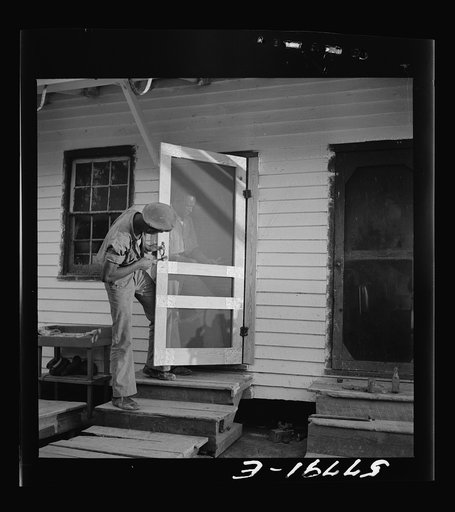 Handle, catch, and spring are added. Demonstration of home screen door construction. Saint Mary's County, Ridge, Maryland