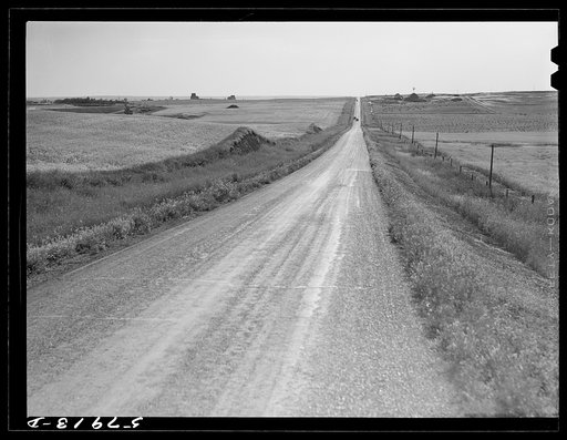 Highway through wheat ranches near Williston, North Dakota
